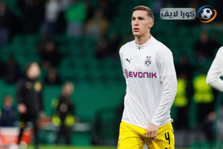 نيكو شلوتربيك يرتدي قميص بوروسيا دورتموند ويحتفل